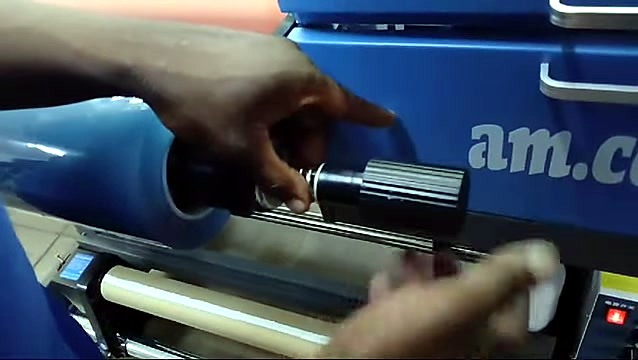 Black tension knob securing B-film roll (SKU ask)