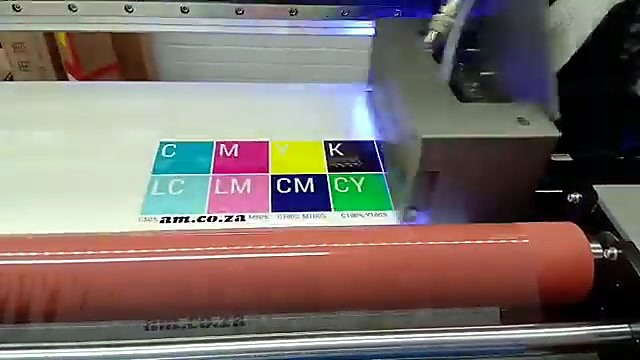 Full-colour C M Y K LC LM swatch block with am.co.za text printed on UV-DTF film