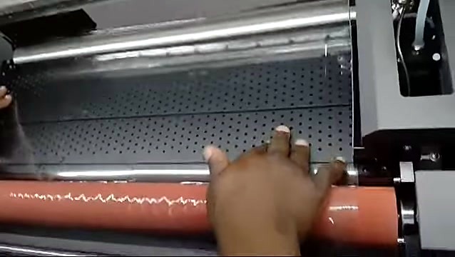 Orange/pink roller over perforated plate (SKU ask)