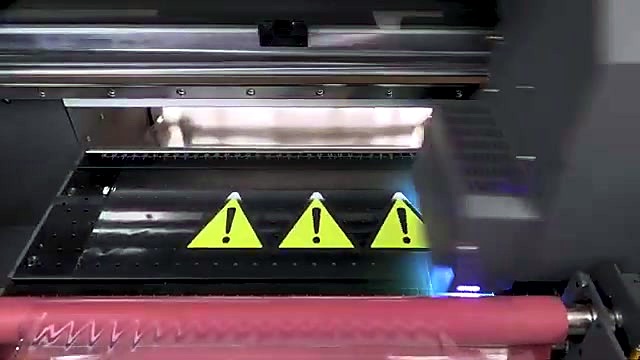 UV cure glow over yellow caution triangles on bed (SKU ask)
