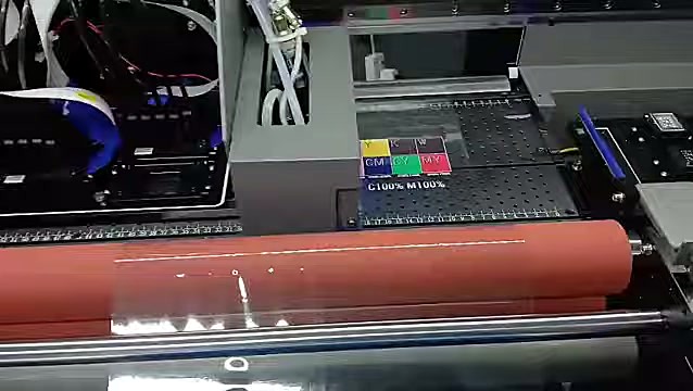 Front orange laminator roller taking printed film (SKU ask)