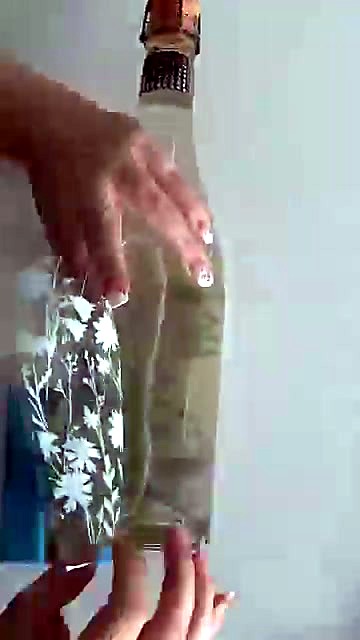 Peeling white floral UV DTF onto glass bottle (SKU ask)