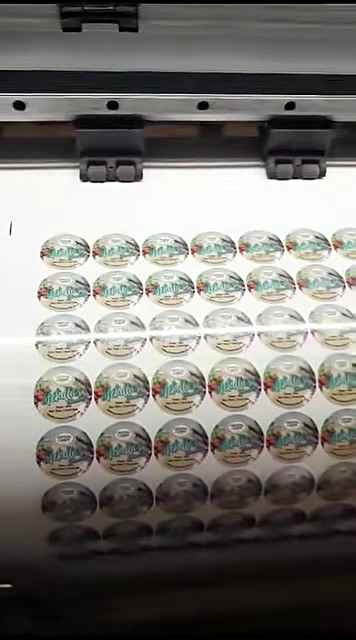 Close grid of circular UV-DTF stickers (SKU ask)