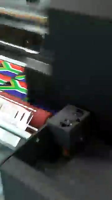Clear film advancing with printed SA flag rows (SKU ask)