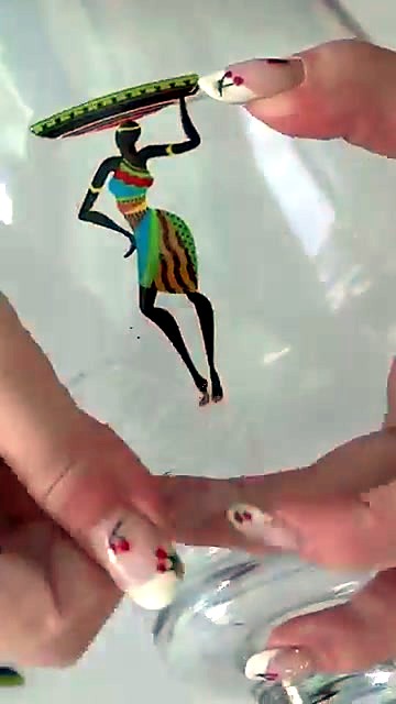 Hands peel carrier after apply on glass vase (SKU ask)