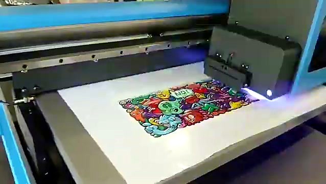 F2-6090C printing a colourful doodle artwork on white vinyl