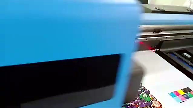 Blue carriage passing with colour alignment swatches printed beside the artwork