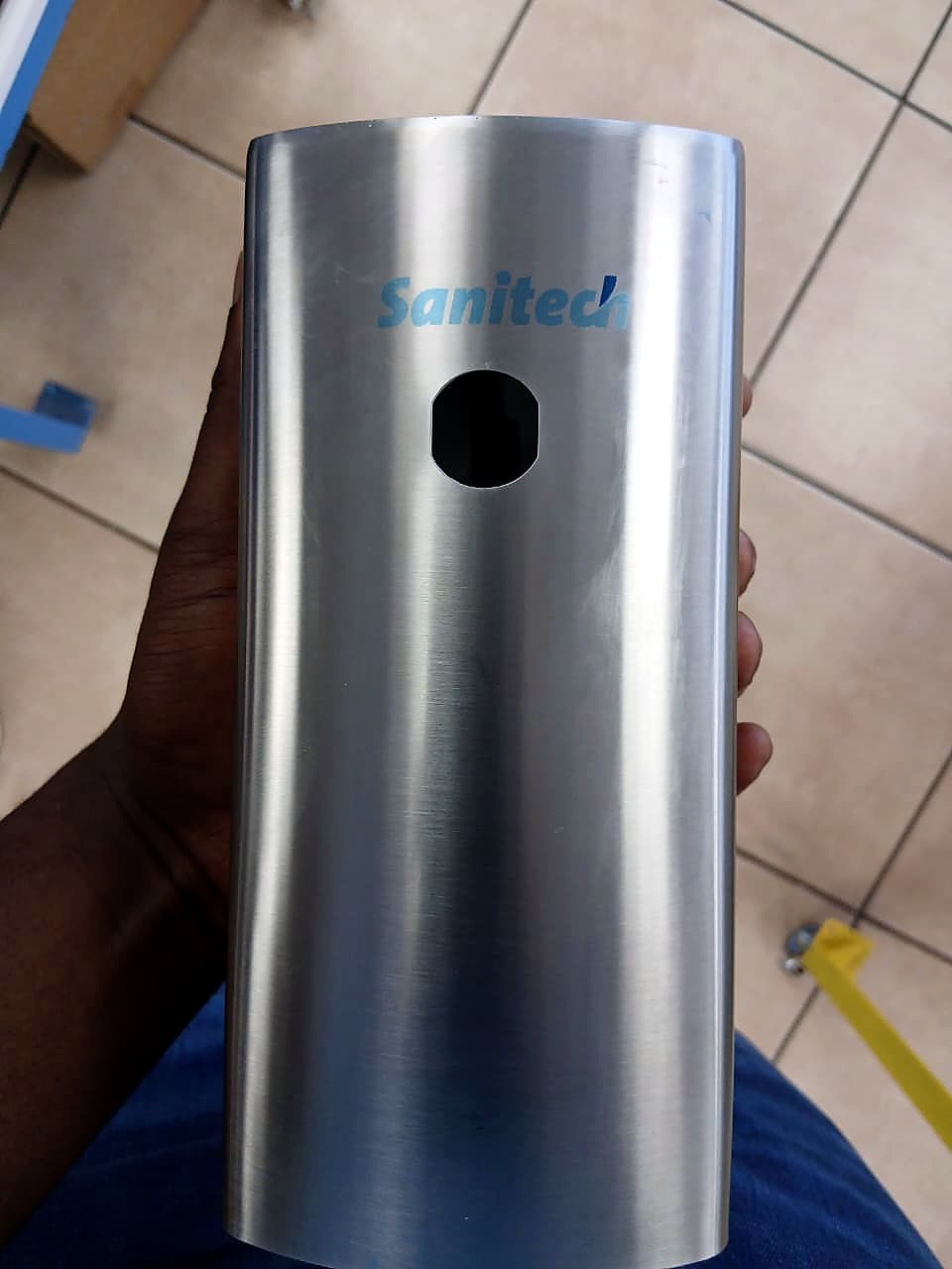 F2-6090C UV print: light-blue Sanitec logo on brushed stainless dispenser housing (staff still)