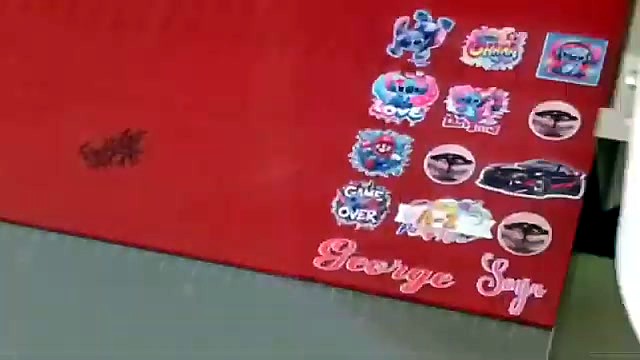 Finished cartoon sticker grid on red acrylic (SKU ask)