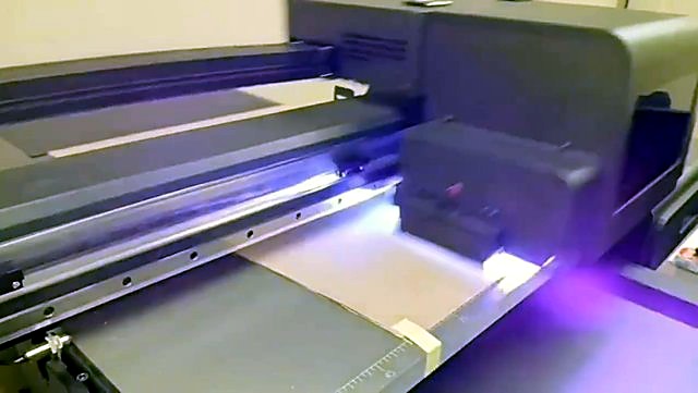 UV flatbed carriage purple cure over tan sheet (SKU ask)