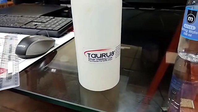 Finished TAURUS flux bottle on desk (SKU ask)