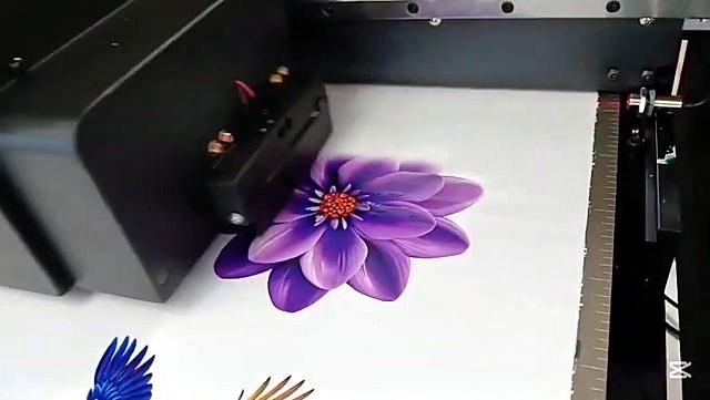 Purple flower UV graphic beside FlatPRINT carriage (SKU ask)