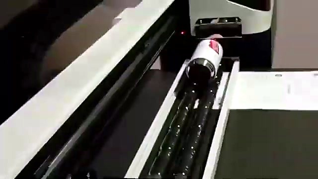 White cylinder loaded on rotary rollers (SKU ask)