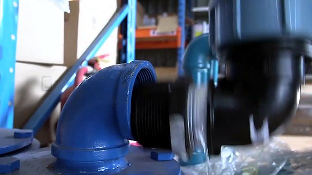 Black thread into blue elbow joint close-up (SKU ask)