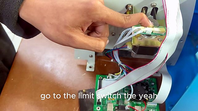 Finger pointing white limit-switch on bracket (SKU ask)