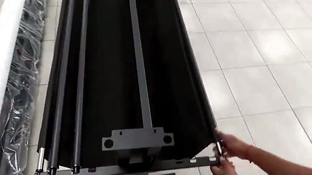 Silver media rollers slotted into stand brackets (SKU ask)