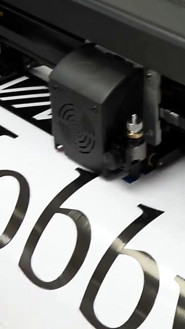 Black carriage cutting numeral 6 on white vinyl (SKU ask)