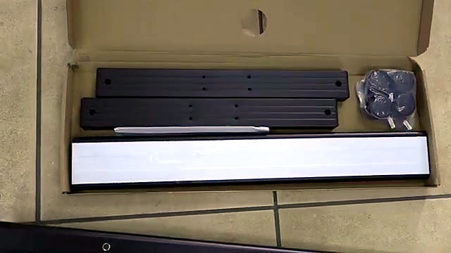 Hobby stand parts unboxed on tiled floor (SKU ask)