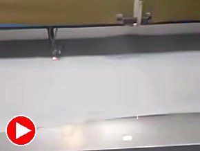 Conveyor bed cutting fabric
